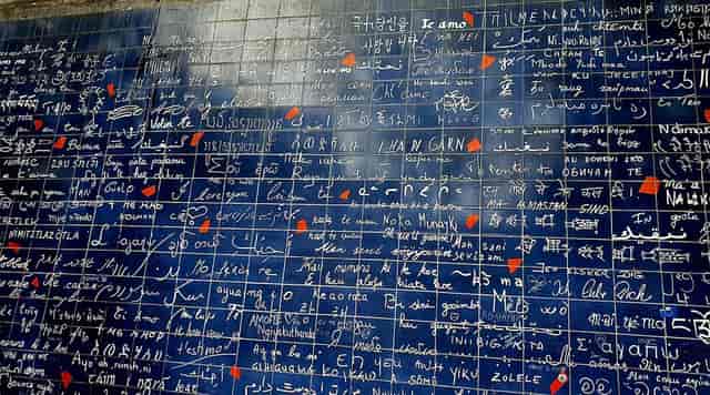 "I Love You" wall in Paris: interactive multilingual art installation for event engagement.