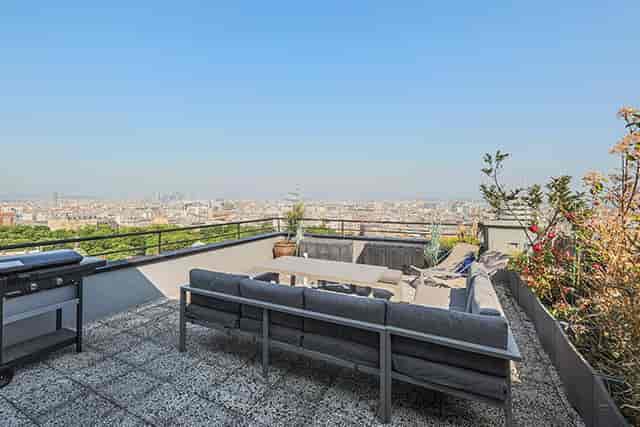 Paris rooftop venue with panoramic views for executive events and sunset receptions.