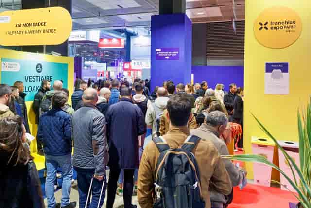 Registration desk at Franchise Expo Paris for event management and trade show planning.