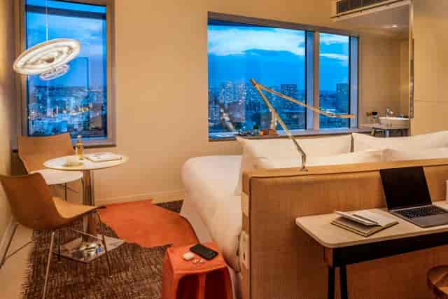 Bleisure hotel workspace at TOO Hotel Paris: ergonomic desk for business travel and remote work.