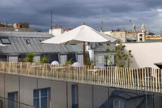 Rooftop lounge at Hotel Opéra Liège with Parisian views for cocktail reception events.