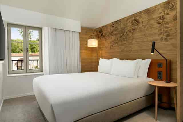 Modern VIP guest room at Dolce Hotel Versailles for corporate retreats and business events.
