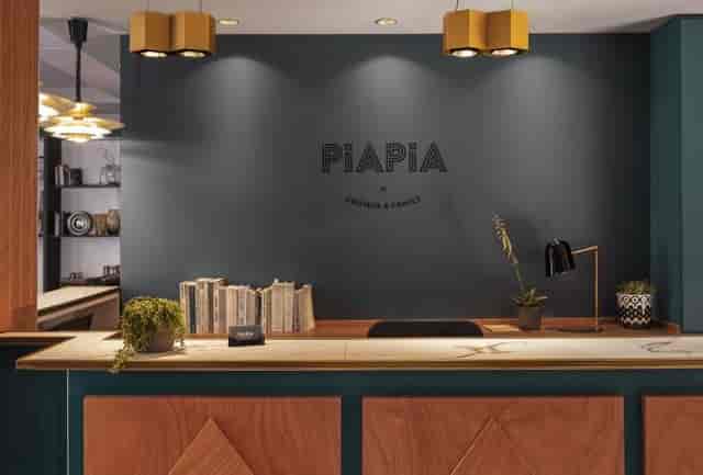 Boutique reception desk at Hôtel Piapia for intimate VIP event registration and check-in.