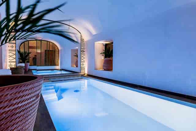 Luxury hotel indoor spa pool for VIP incentive retreat or corporate wellness event.