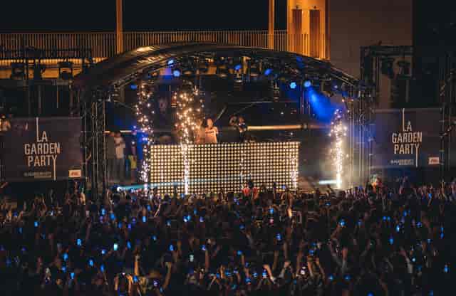 Hippodrome ParisLongchamp La Garden Party stage with pyrotechnics for live outdoor event.