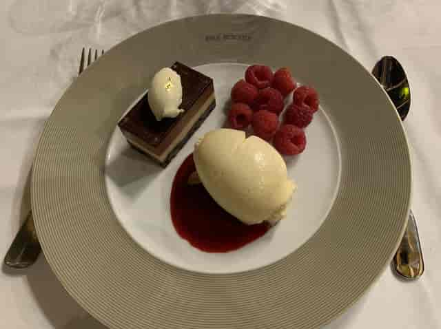 High-end plated dessert at Irma Bocuse gala dinner, gourmet catering, VIP executive event.