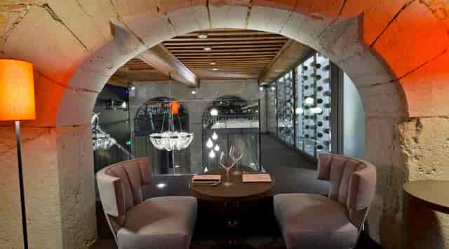 Elegant Burgundy restaurant for VIP breakout sessions and high-end corporate negotiations.
