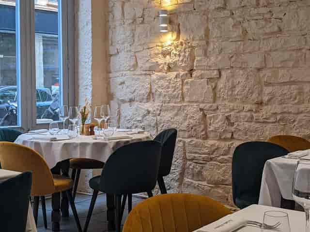 Upscale Burgundy restaurant setting for intimate VIP dinners and client networking events.