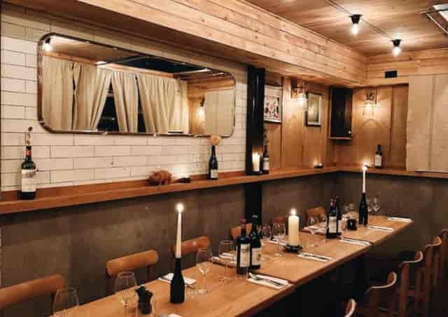 Rustic-chic Tap Room at Fire & Wine for intimate private dining and sophisticated networking events.