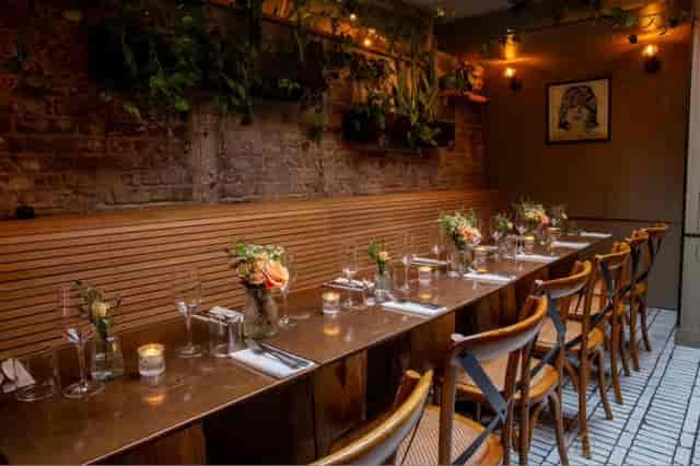The Tap Room at Fire & Wine: Intimate banquette seating for private dining and corporate events.