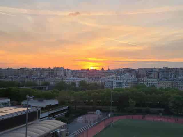 Rooftop meeting room with Parisian skyline view for upscale networking events and receptions.