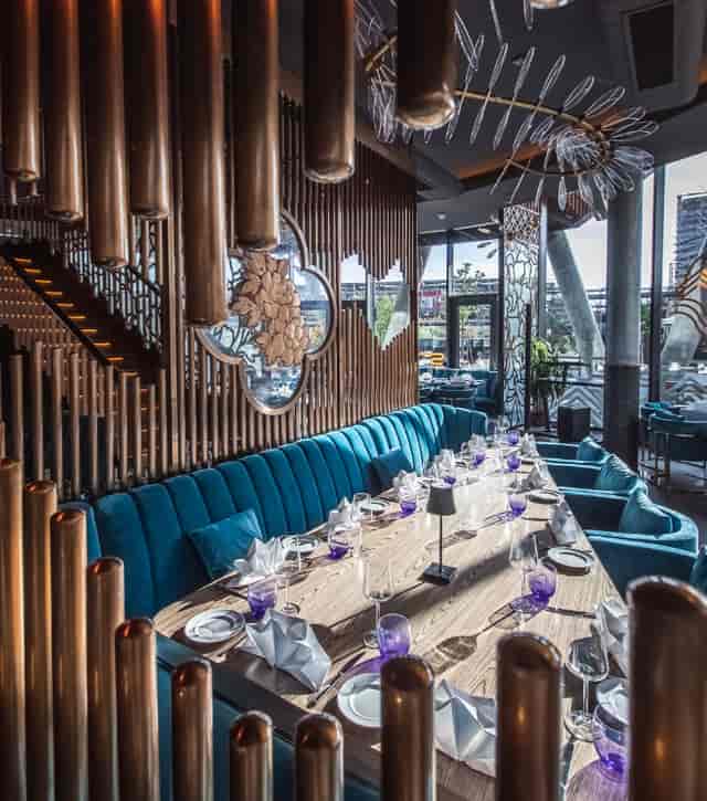Ommia luxury dining venue with velvet seating, ideal for upscale boardroom dinners and events.