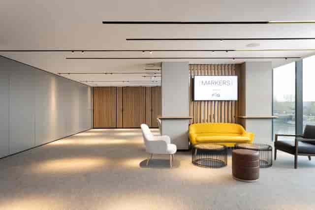 Modern reception area with stylish seating for meetings and events at Fulham Pier.