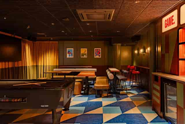Vibrant event space with flexible seating for team-building and social gatherings.