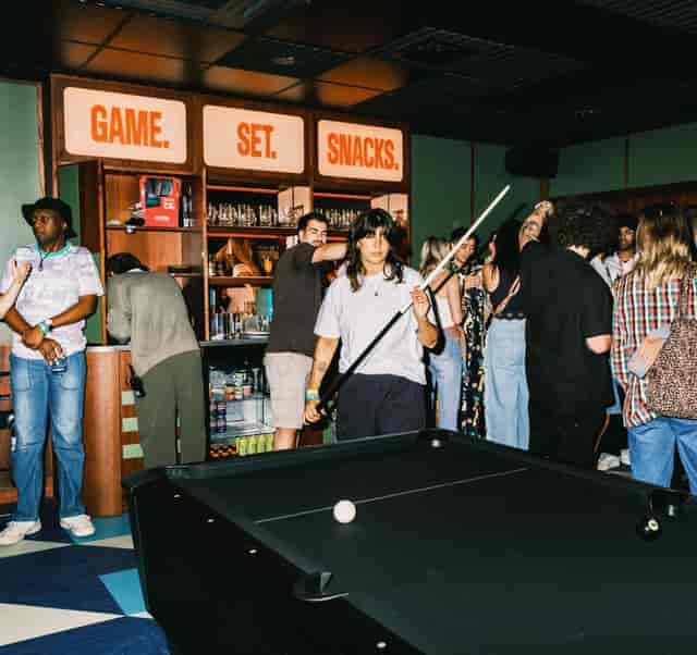 Lively event space at KERB Social Club with snacks for networking and camaraderie.