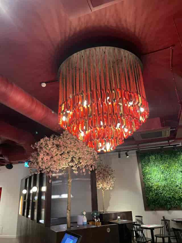 Avant-garde telephone handset chandelier for networking lounge or themed event decor.