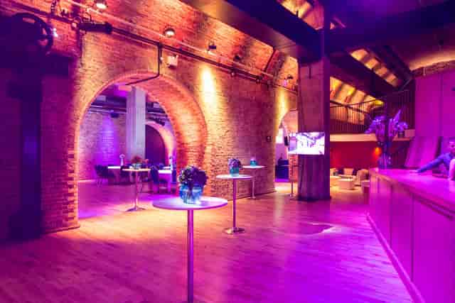 "Ante Chamber PDR venue with exposed brick walls, perfect for receptions or networking events."