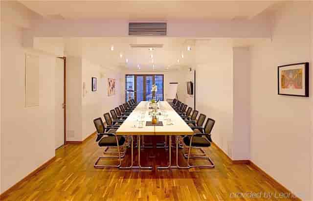 Boardroom setup at Wieland Hotel for corporate meetings and workshops.