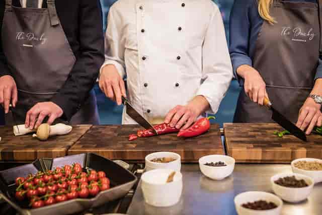 Team-building culinary workshop at Theodor-Körner Salon for corporate event and group activities.