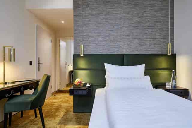 Carls Lounge guest room with workspace for business travel and corporate event accommodation.