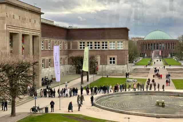 Long queue at Kunstpalast Düsseldorf venue check-in for event registration and crowd management.