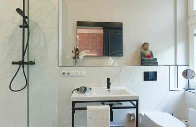 Luxury hotel bathroom with premium amenities for VIP travel and corporate event accommodation.