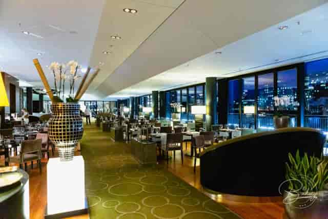 Private dining room at DOX Restaurant with city views for corporate dinners and networking events.