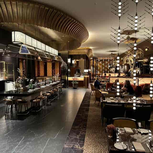 River Salon I venue at DOX, plush lounge seating for VIP dinners and corporate networking events.