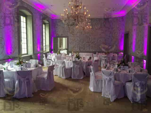 Purple uplighting in Roland-Weber-Festsaal ballroom for gala or wedding reception.