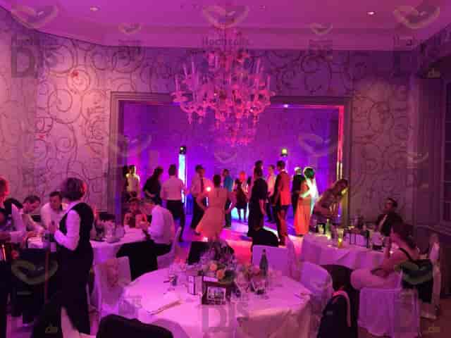 Roland-Weber-Festsaal ballroom with magenta lighting for elegant wedding and gala events.