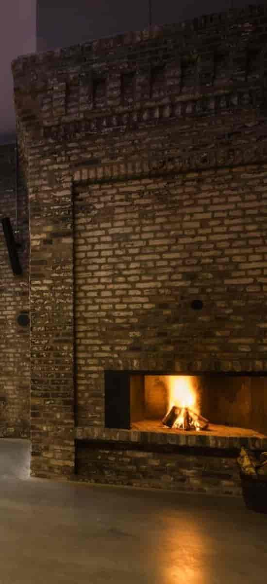 Exposed brick wall at Furnace Harbour Club, industrial chic event venue backdrop.