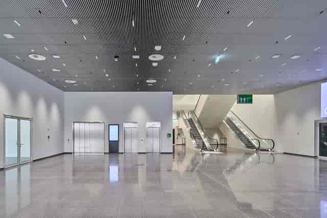 Minimalist conference foyer for large-scale registration and event branding.