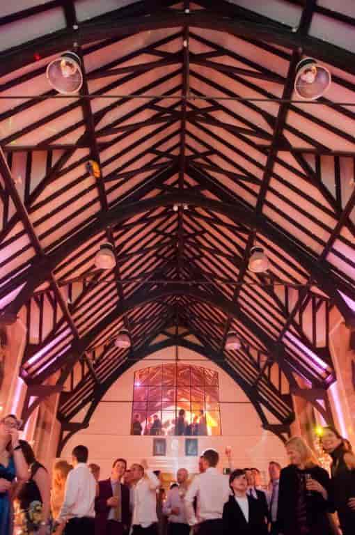 Priory Community Hall featuring architectural lighting and balcony for weddings and events.