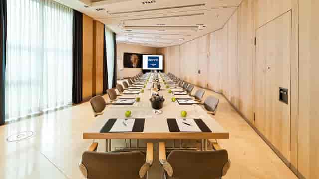 Boardroom setup in Dorint Hotel Köln with hollow square table for executive meetings and events.