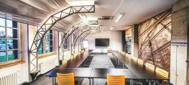 U-shape boardroom at Motorworld Köln, industrial event venue for workshops and corporate meetings.