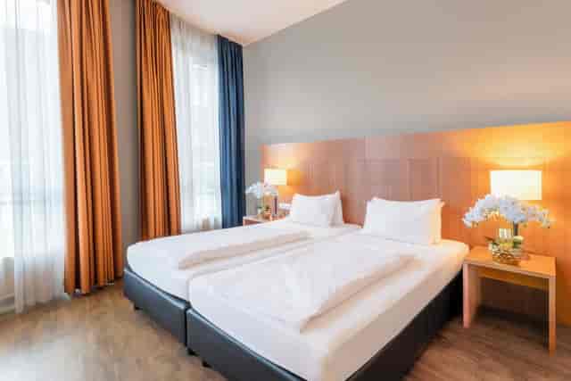 Twin room at PLAZA Premium Hotel Köln, ideal for business conferences and hotel event bookings.