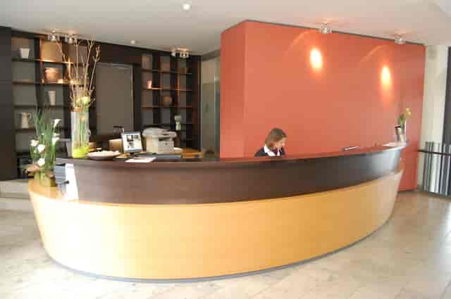 Hotel Begardenhof reception desk for event check-in and conference registration.