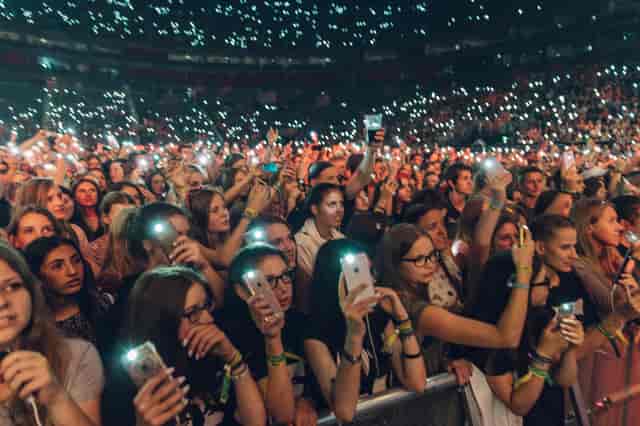 Sold-out crowd at LANXESS arena concert hall for immersive live event marketing.