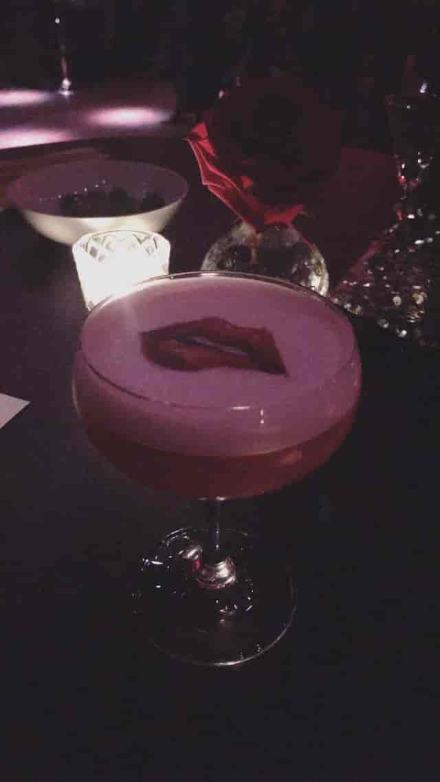 Branded cocktail garnish at a Penthouse Santa Caterina gala for exclusive evening reception events.