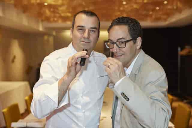 Chef and organizer collaborating at Caelis Privé for high-end corporate event F&B consultation.