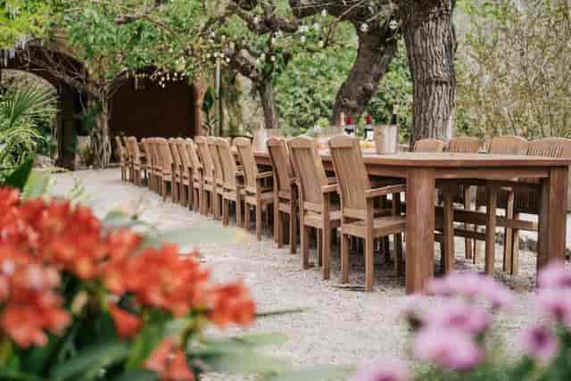 Long table dinner setup in Villa Almanita garden for intimate events and outdoor social gatherings.
