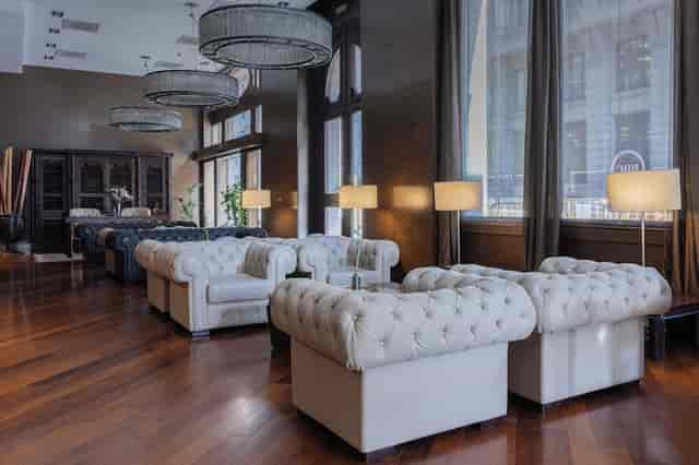 Hotel Colonial Barcelona meeting room with tufted seating for VIP networking and breakout sessions.