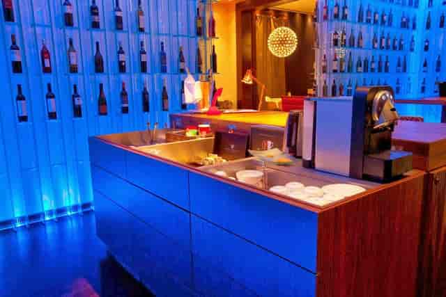 Meeting Room 62 coffee station with blue ambient lighting for VIP lounge or corporate event breakout.