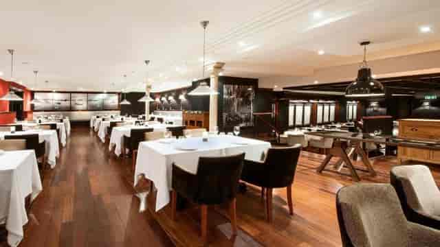 Elegant Hotel 1898 meeting room, upscale setting for corporate dinners and networking events.