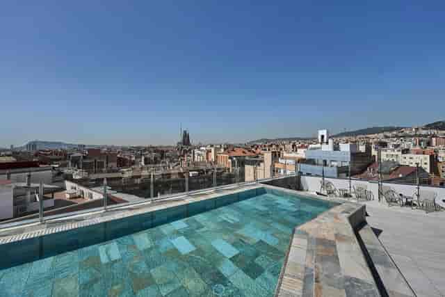 Rooftop venue in Barcelona with iconic skyline view for corporate cocktail networking events.