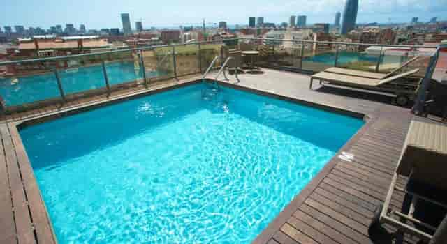 Rooftop pool at Catalonia Atenas with city views for VIP networking events and corporate receptions.
