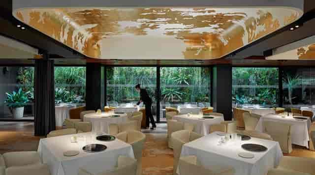 Moments restaurant Barcelona gold-leaf ceiling, ideal for executive retreats and gala dinners.