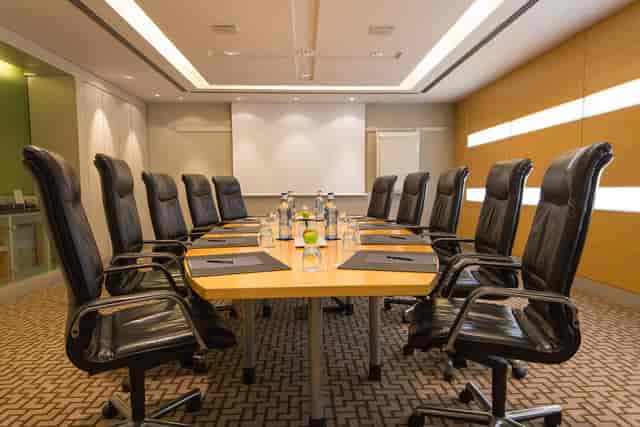 Boardroom at Hilton Barcelona with executive chairs for professional meetings and conferences.