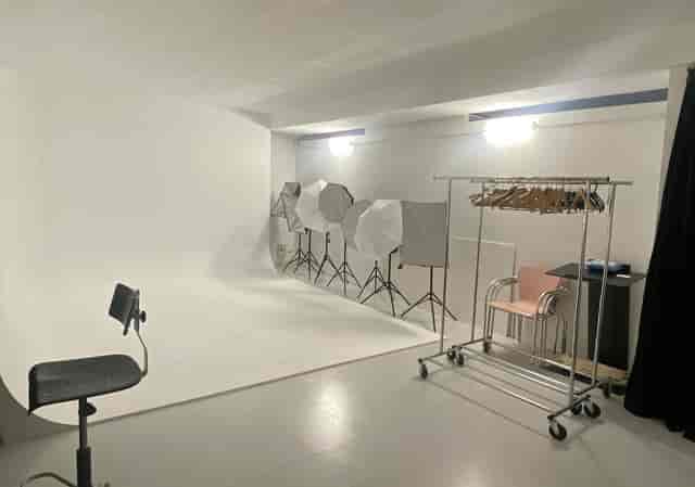 Minimalist studio space for corporate event headshots and product photography.