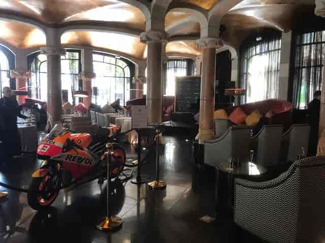 Branded motorcycle at a luxury corporate event activation in Hotel Casa Fuster, Vienna.